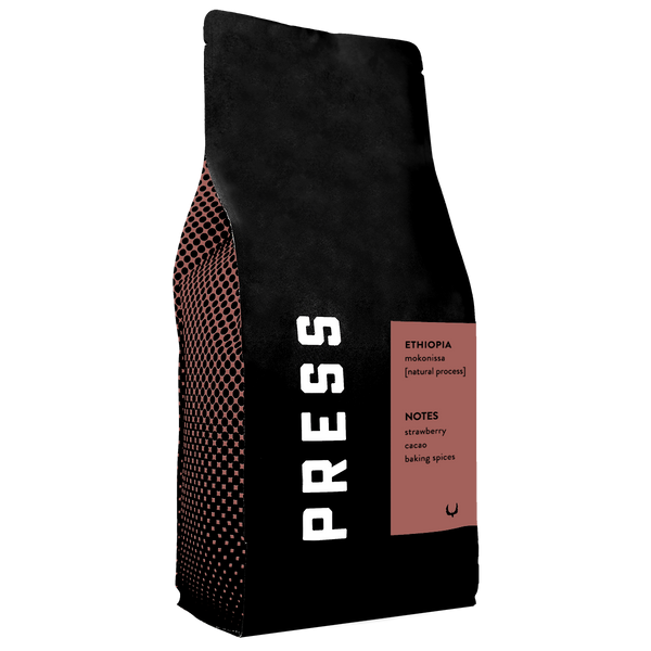 Black coffee bag with 'PRESS' branding and Ethiopia coffee details on a white background