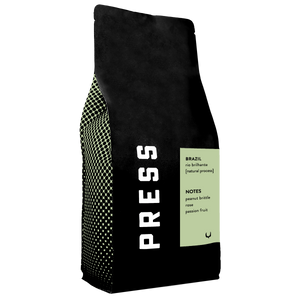 Black coffee bag with 'PRESS' branding and information on a white background