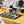 Load image into Gallery viewer, Coffee 101 table spread including ground coffee, cups, placemats, spoons, and more. 
