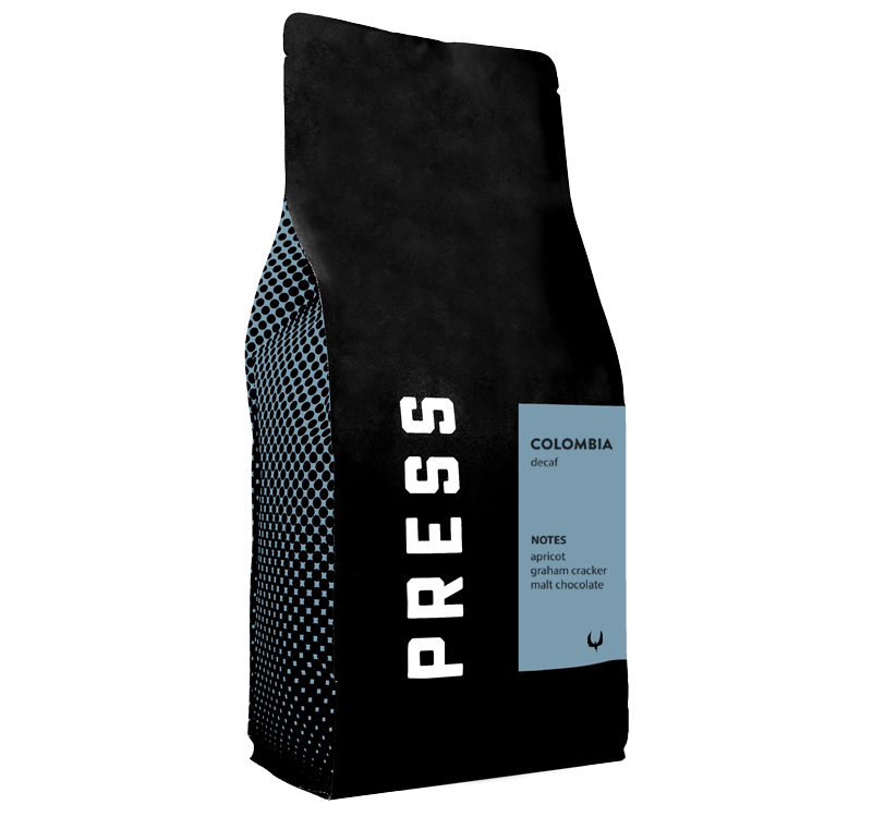 Black coffee bag with 'PRESS' branding and Colombia coffee details on a white background