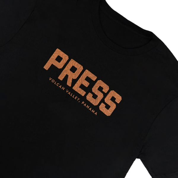 Black sweatshirt with 'PRESS' and 'Volcan Vallely Panama' text in orange on a white background