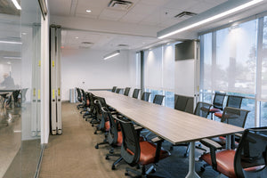 Gilbert Reserve conference room featuring conference room table, chairs, and bright open windows. 